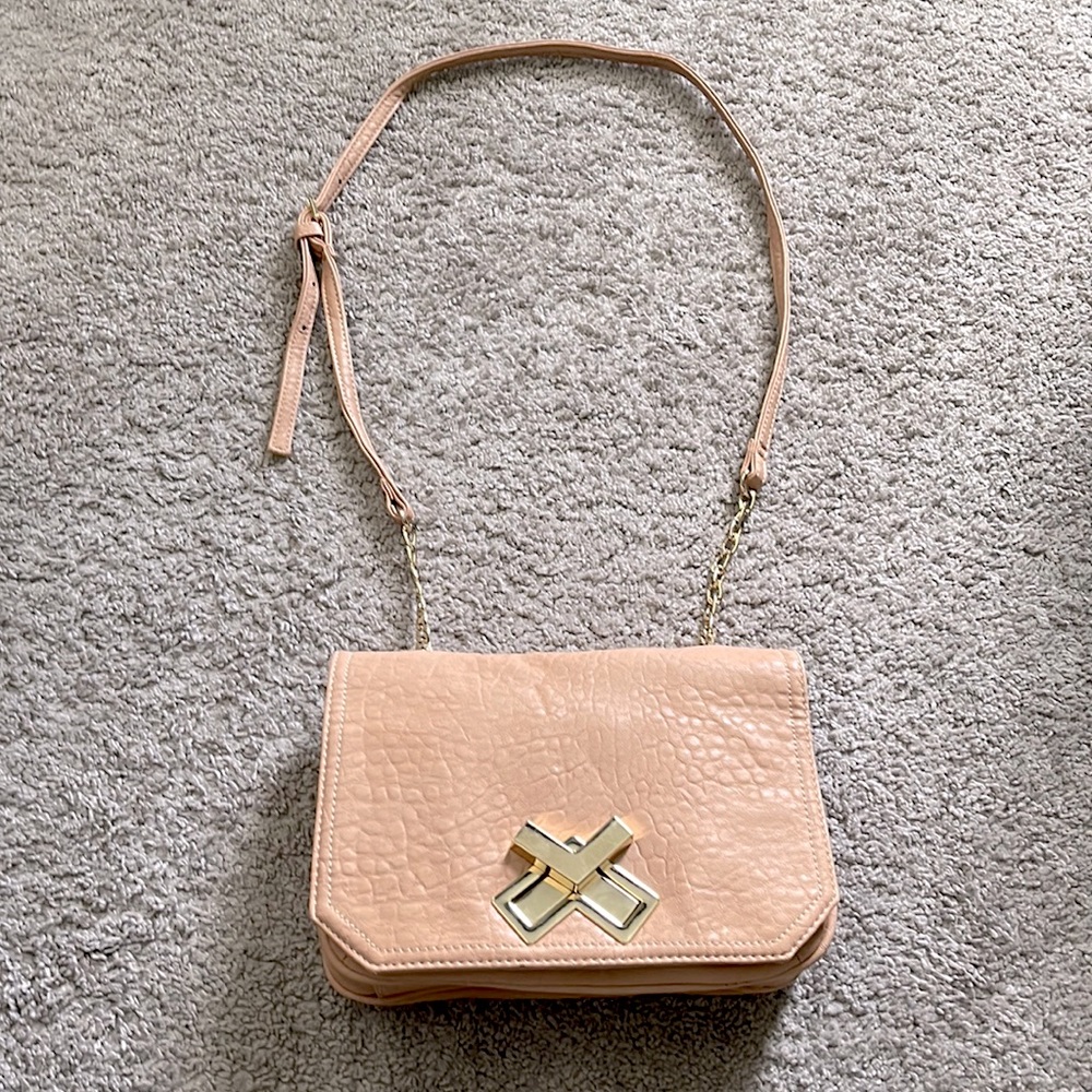 Deux Lux pink faux leather hand bag with gold V lock